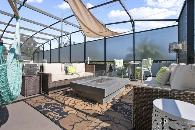 a view of a chairs and tables in a patio