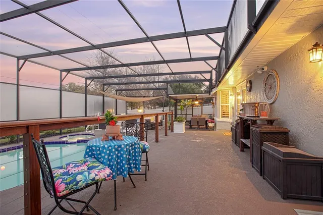 a view of a swimming pool with a patio