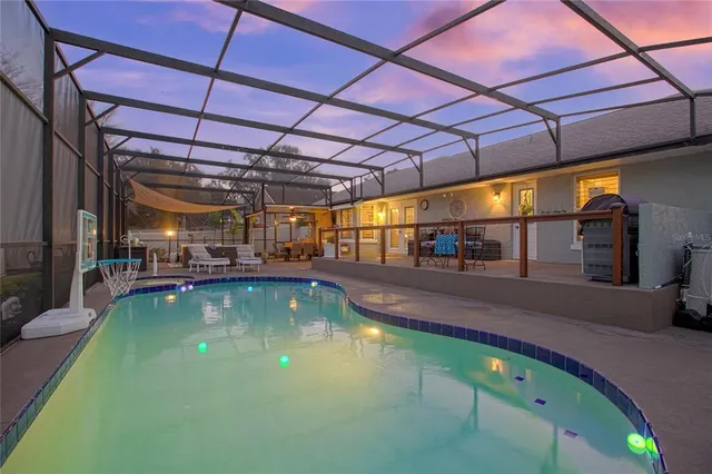 a view of swimming pool with outdoor seating