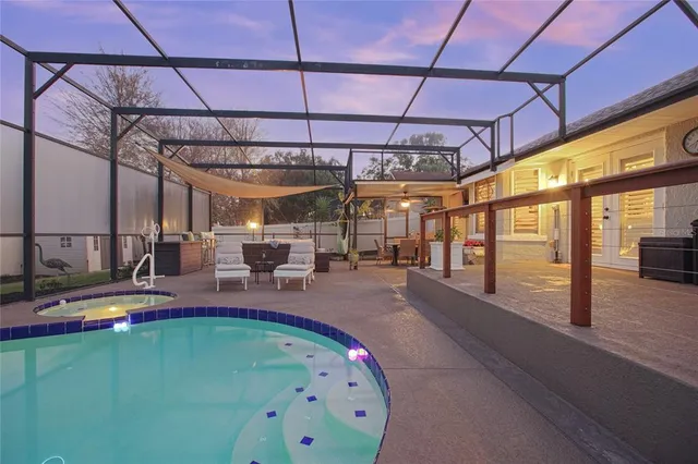 a swimming pool with outdoor seating