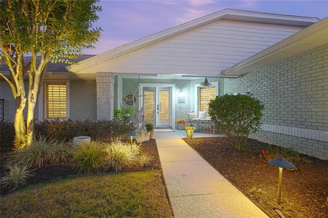 a view of a patio with a table and chairs