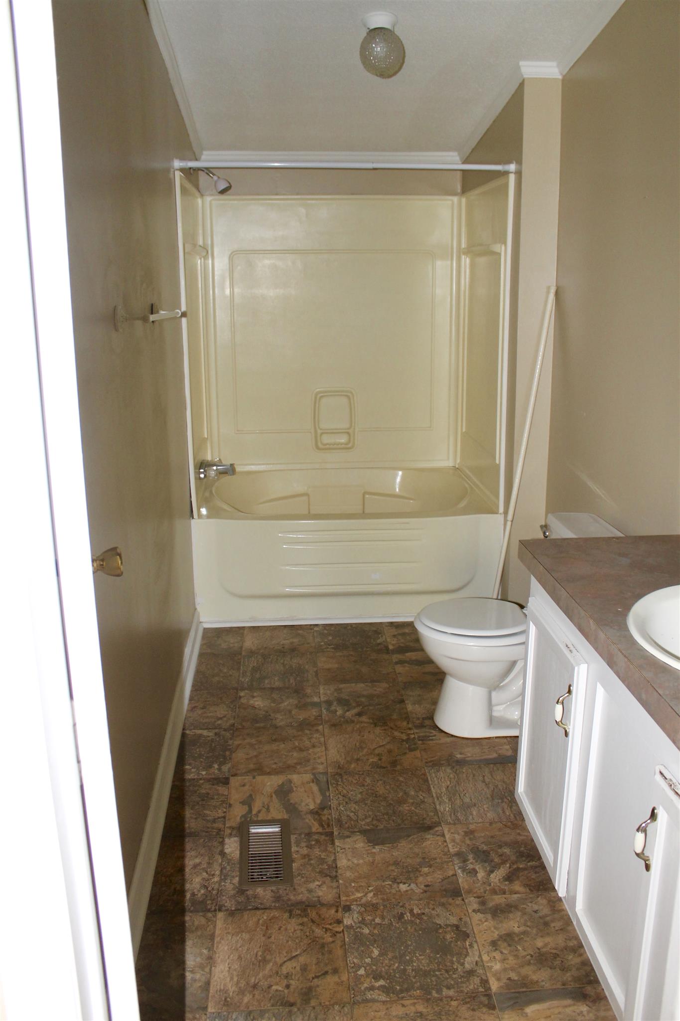 297 Longbranch Road Hohenwald, TN 38462 - Photo 4 of 13 MASTER BATH WITH VINYL FLOOR AND COMBO TUB/SHOWER