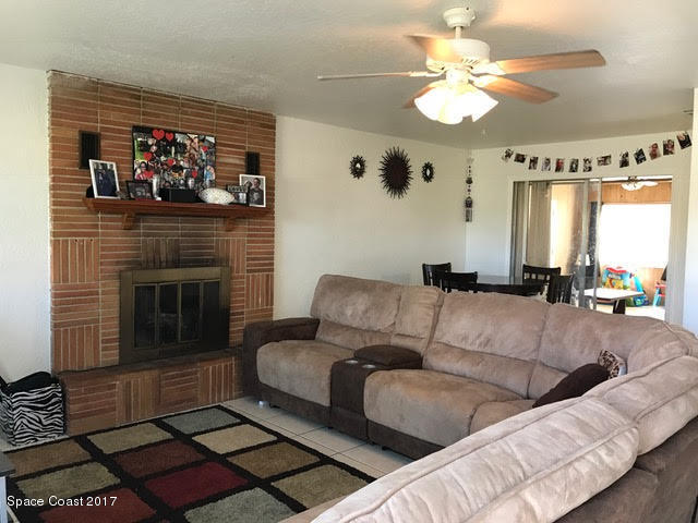 22 Butler Street Melbourne, FL 32901 - Photo 6 of 17 Living room with fireplace