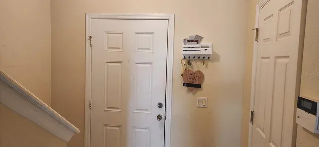 a view of a hallway view with staircase