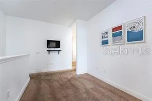 a view of a hallway with bathroom