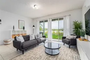 a living room with furniture and a large window