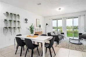 a view of a dining room with furniture window and outside view
