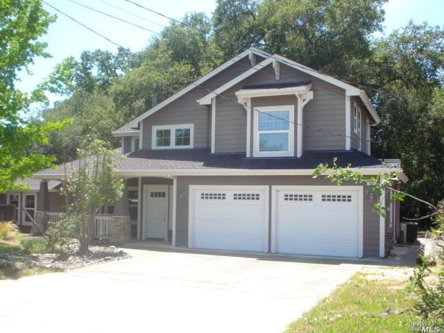 939 Middle Rincon Road Santa Rosa, CA 95409 - Photo 1 of 1 a front view of a house with a yard and garage