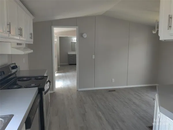 a view of a livingroom and hardwood floor