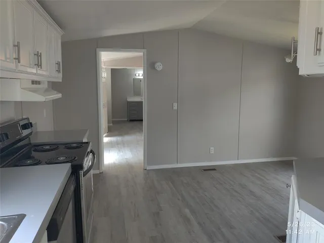 a view of a livingroom and hardwood floor