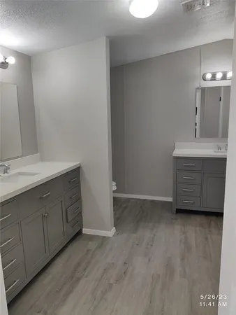 a view with cabinets and wooden floor