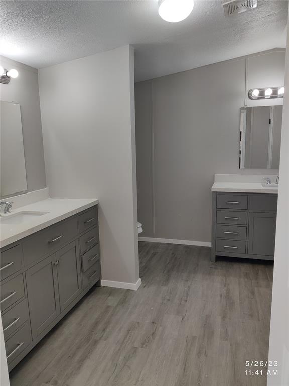 307 Jones Circle Pottsboro, TX 75076 - Photo 7 of 11 a view with cabinets and wooden floor
