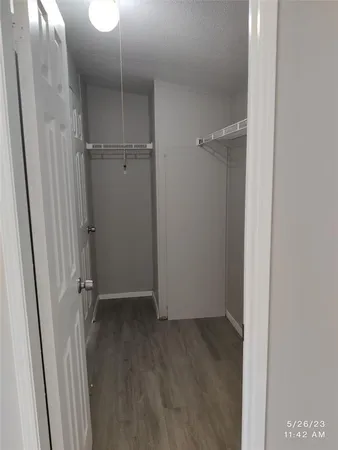 a white toilet sitting next to a bath tub