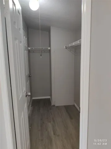 a white toilet sitting next to a bath tub