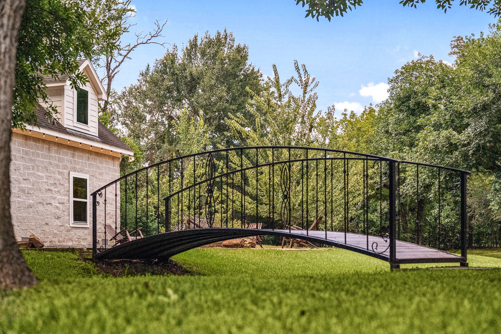 6039 Franz Road Katy, TX 77493 - Photo 41 of 49 A charming footbridge connects the workshop barn area to the surrounding grounds, adding another distinctive element to this expansive property.
