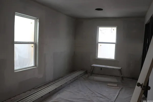 a living room with a fireplace and a flat screen tv