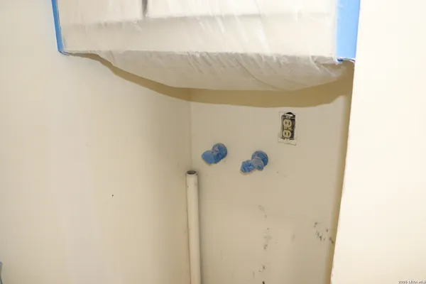 a bathroom with a toilet sink and a window