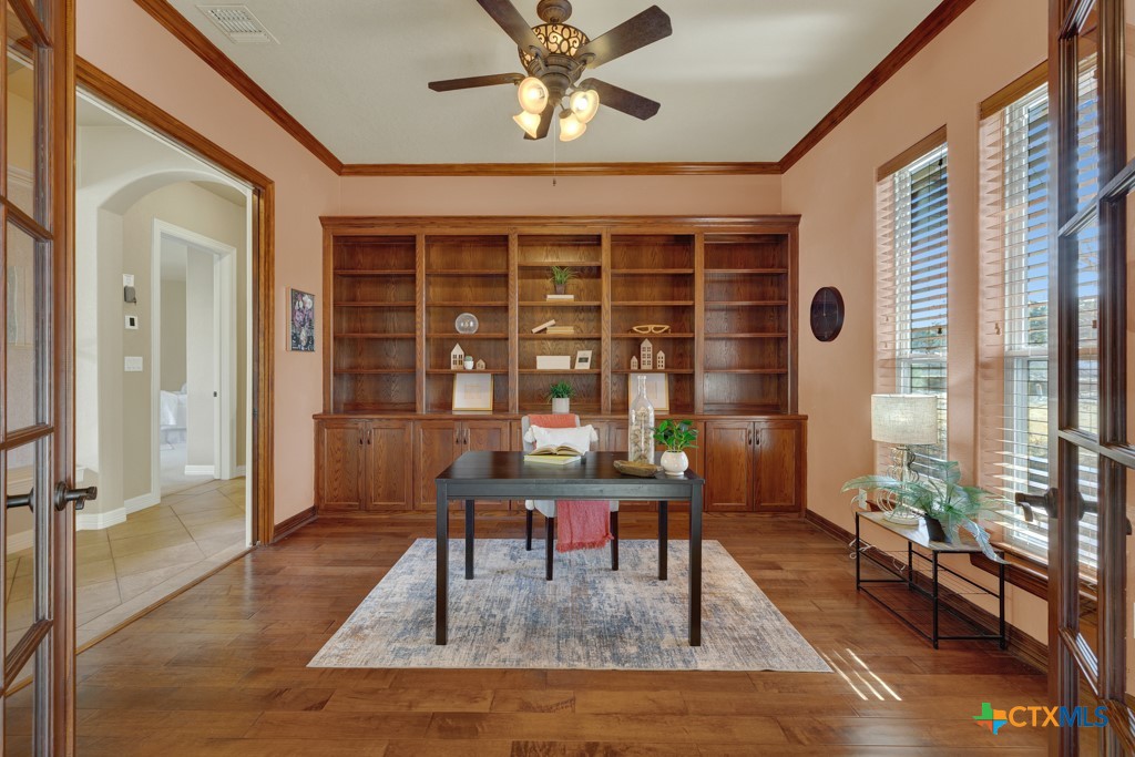 7607 Sky Loop Garden Ridge, TX 78266 - Photo 22 of 43 a dining room with wooden floor and furniture