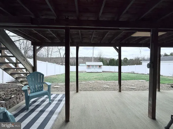 a view of a porch with wooden floor