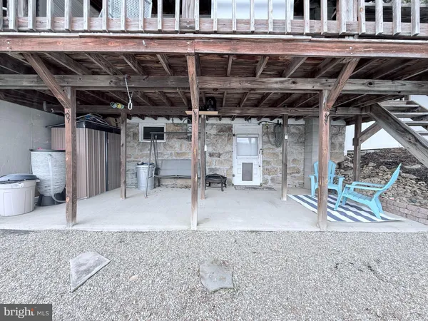 a view of a room with wooden roof and sitting space