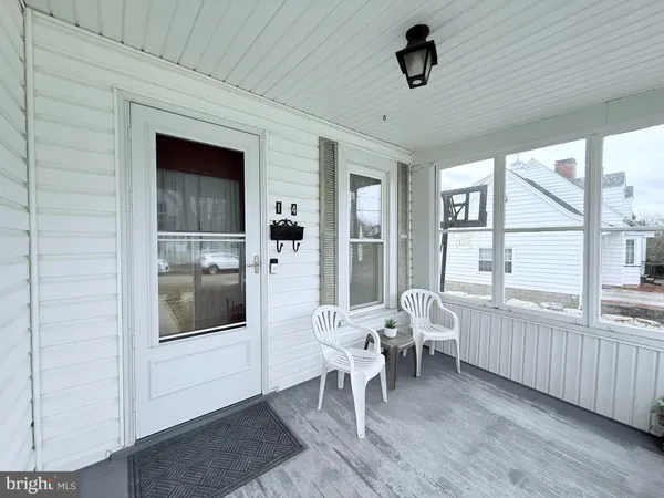 a dining room with furniture and windows