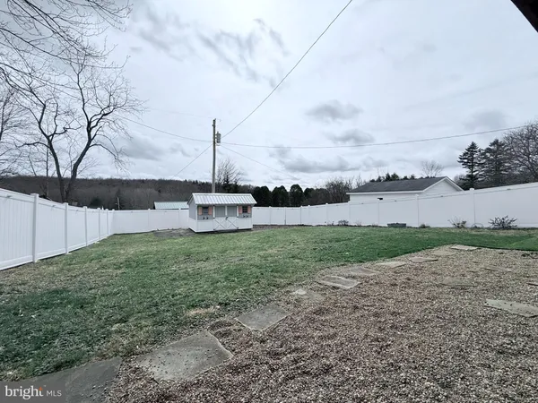 a green field with view of house