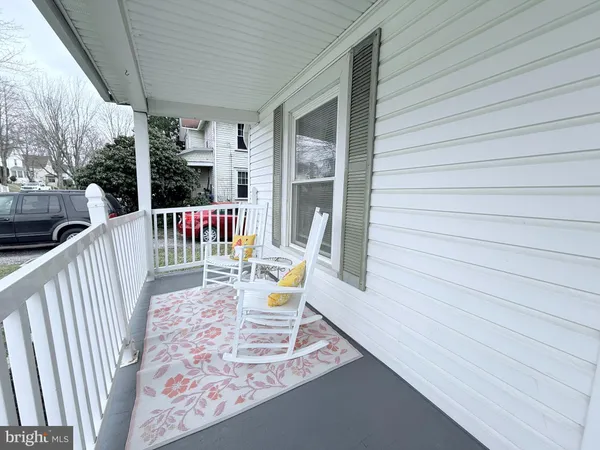 a view of a patio with a table chairs and deck