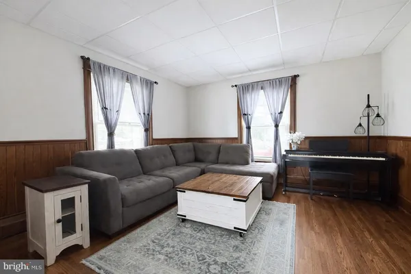 a living room with furniture and a window