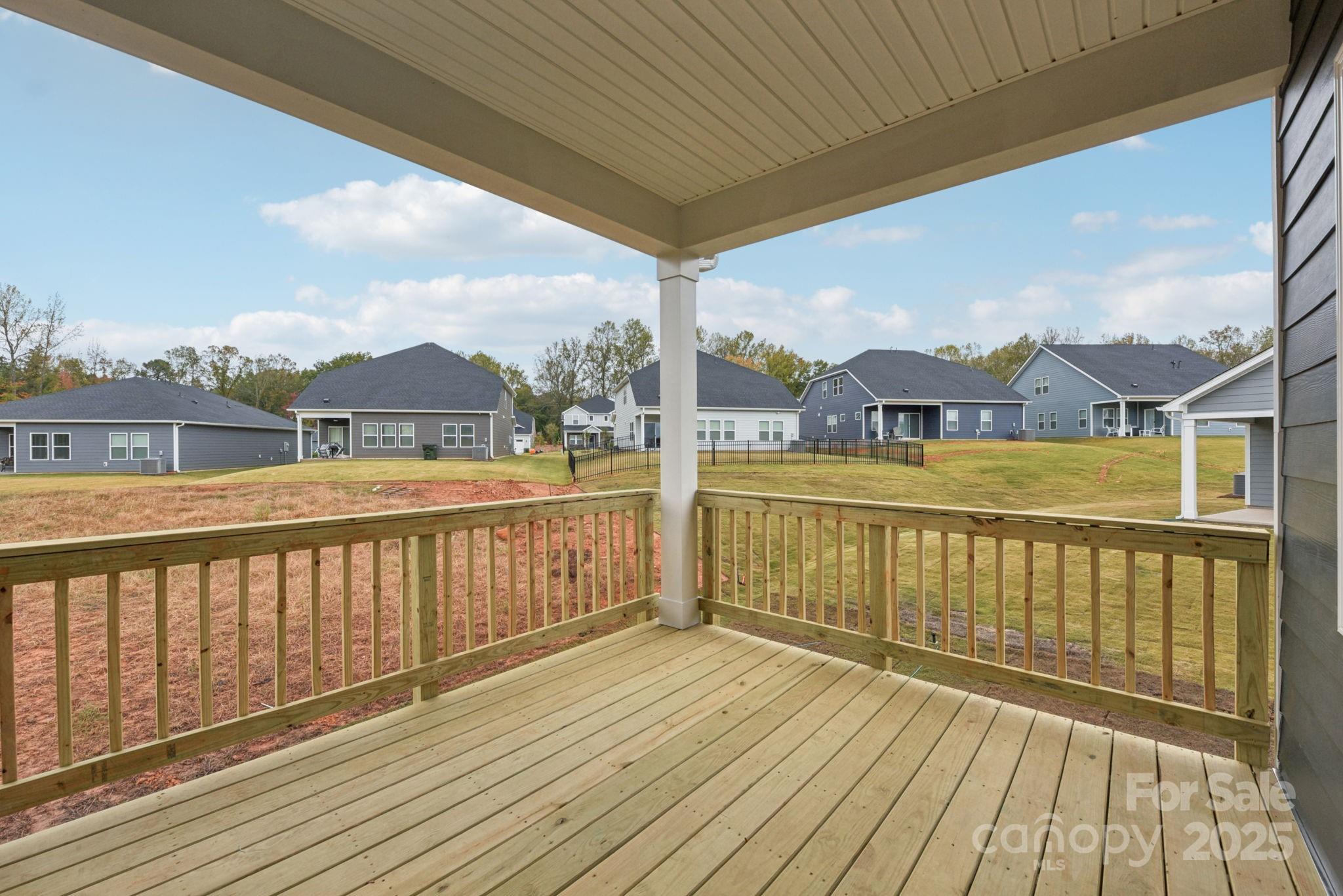 712 Palmer Pendleton Way York, SC 29745 - Photo 30 of 36 a view of a balcony with wooden floor next to a yard
