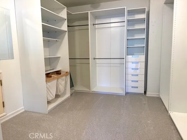 a view of an empty walk in closet