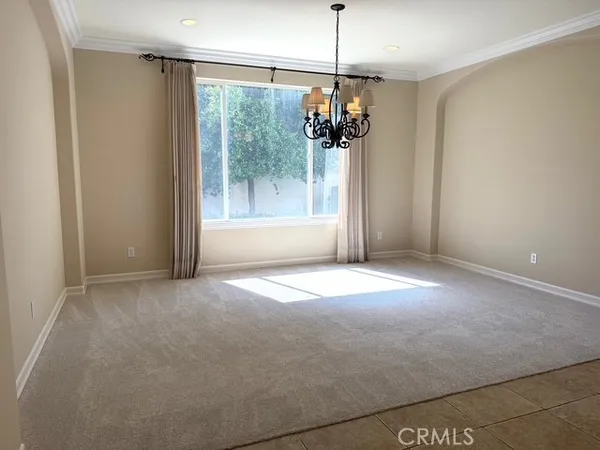 a view of a kitchen with a sink and refrigerator