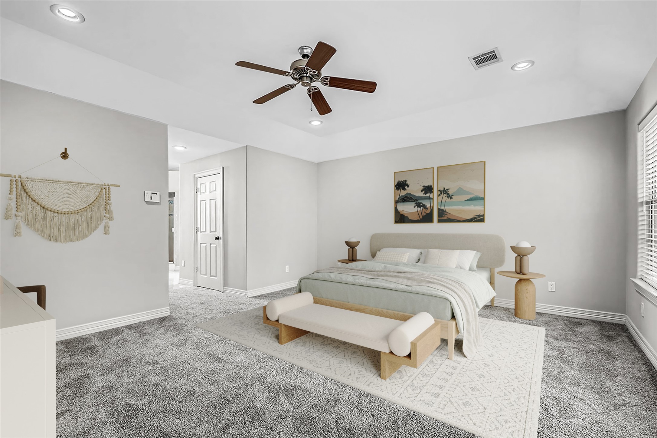 806 East 29th Street Houston, TX 77009 - Photo 14 of 30 This spacious primary bedroom features a neutral color palette, plush carpet, and ample natural light. It includes a ceiling fan, modern furnishings, access to an ensuite bathroom, and access to a sunroom, creating a cozy and inviting retreat. *This photo is virtually staged.