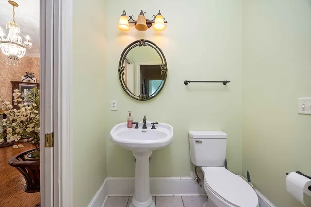 a bathroom with a sink toilet and vanity