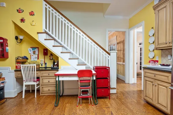 a kitchen with granite countertop a sink cabinets and stainless steel appliances