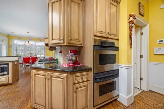 a bedroom with a bed and cabinets