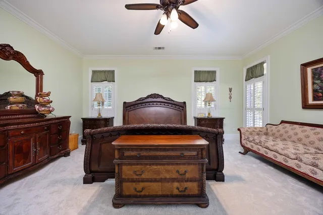 a spacious bathroom with a double vanity sink mirror and bathtub
