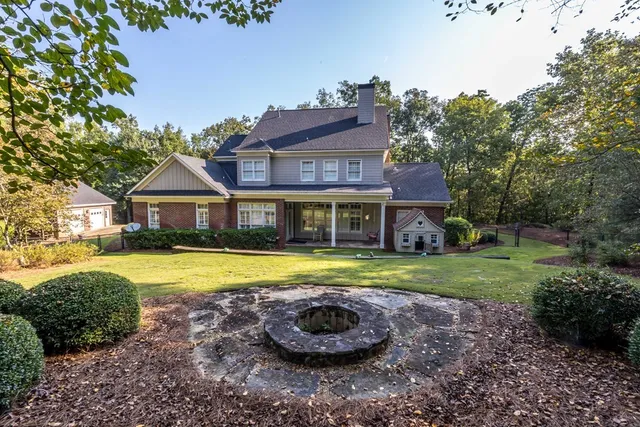 a view of front of house with a yard
