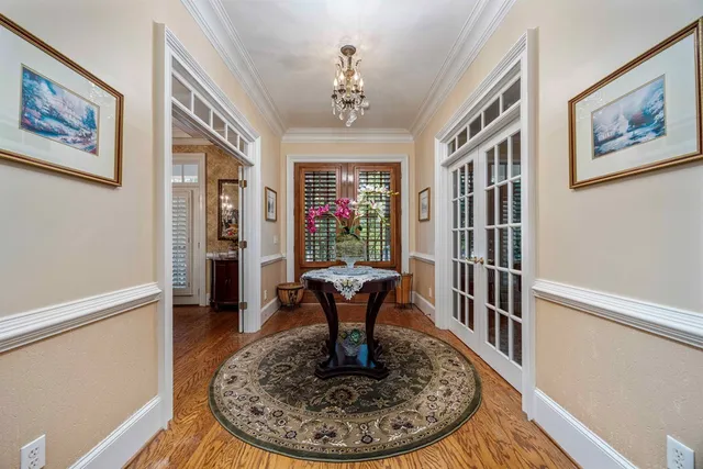 a view of a livingroom with furniture window and wooden floor