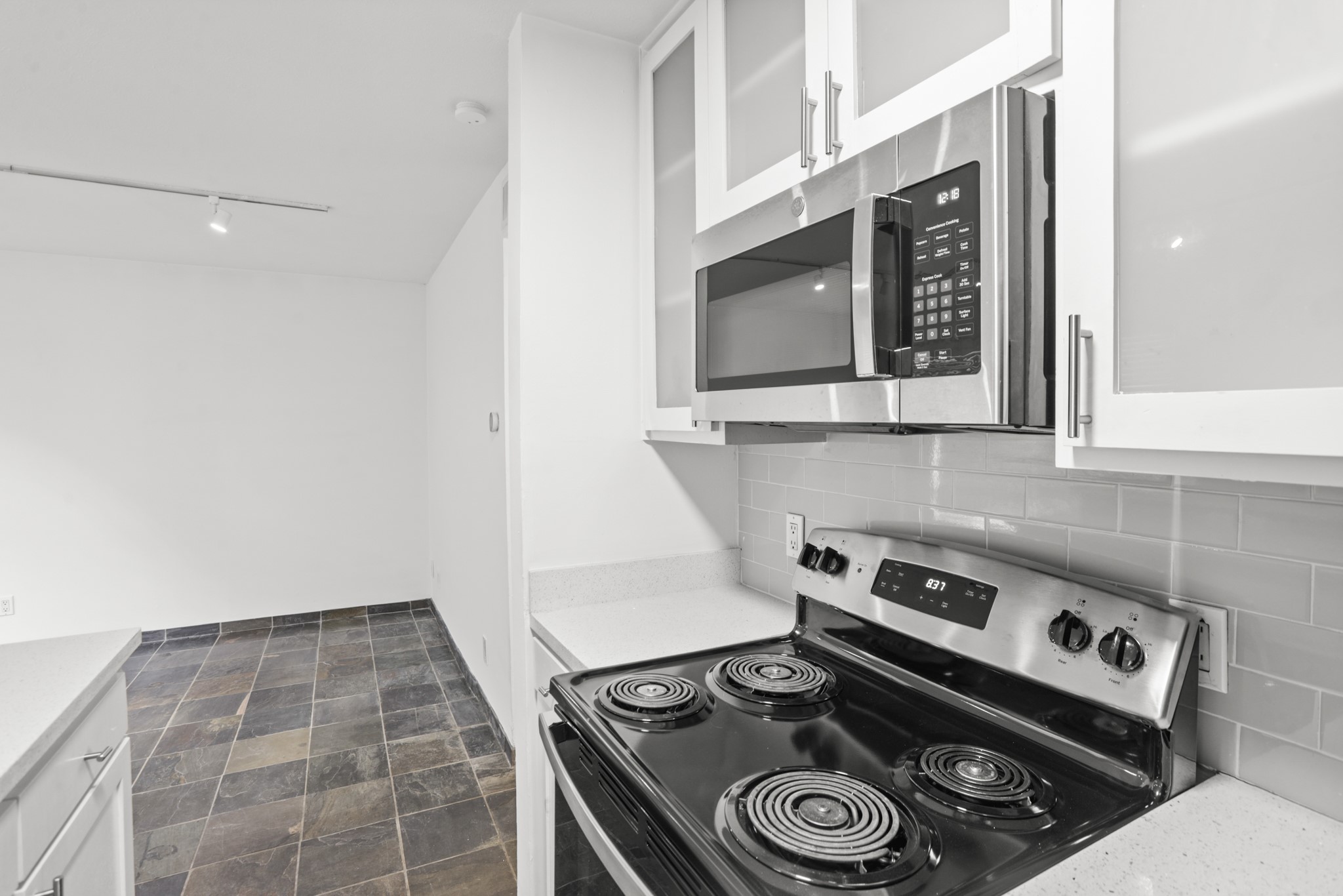 3602 Garrott Street, Unit 11 Houston, TX 77006 - Photo 12 of 34 a stove top oven sitting inside of a kitchen