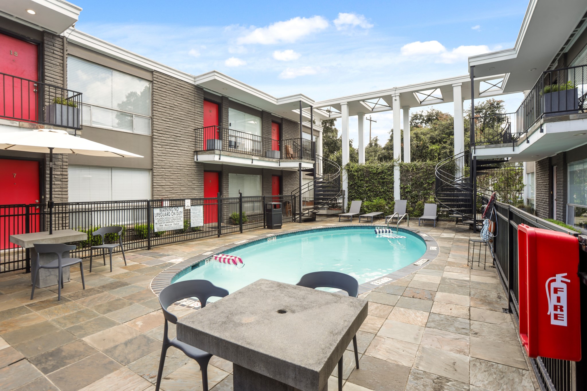 3602 Garrott Street, Unit 11 Houston, TX 77006 - Photo 30 of 34 a swimming pool with outdoor seating and yard