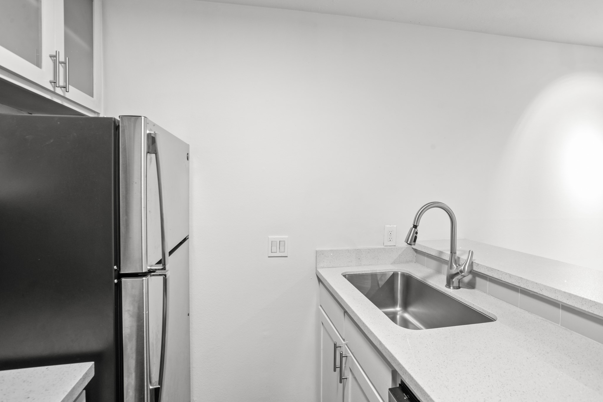 3602 Garrott Street, Unit 11 Houston, TX 77006 - Photo 9 of 34 a close view of a sink and refrigerator