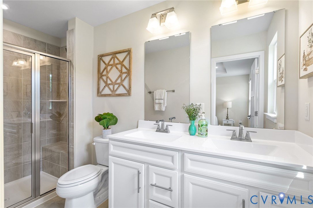 1255 Lazy River Road Midlothian, VA 23114 - Photo 18 of 27 a bathroom with a granite countertop sink toilet and shower