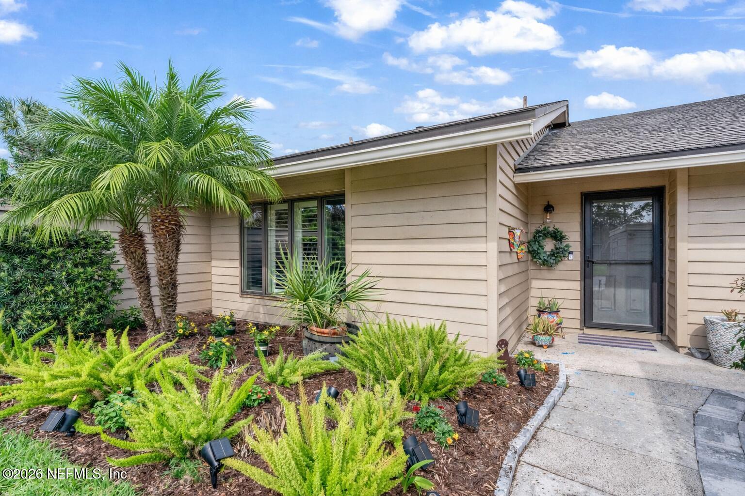 70 Fishermans Cove Road Ponte Vedra Beach, FL 32082 - Photo 2 of 60 a front view of a house with a yard