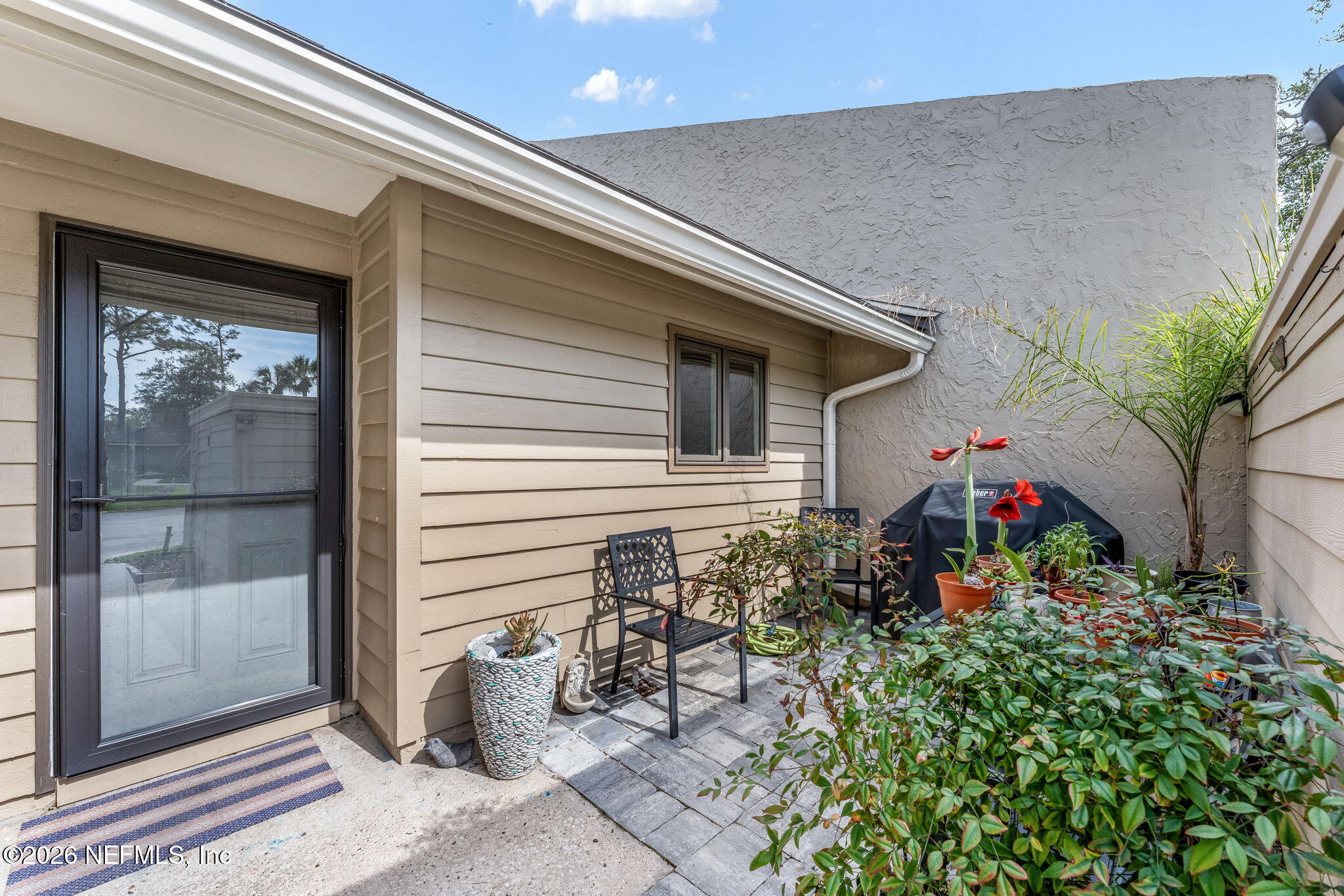 70 Fishermans Cove Road Ponte Vedra Beach, FL 32082 - Photo 4 of 60 a view of front door and potted plants