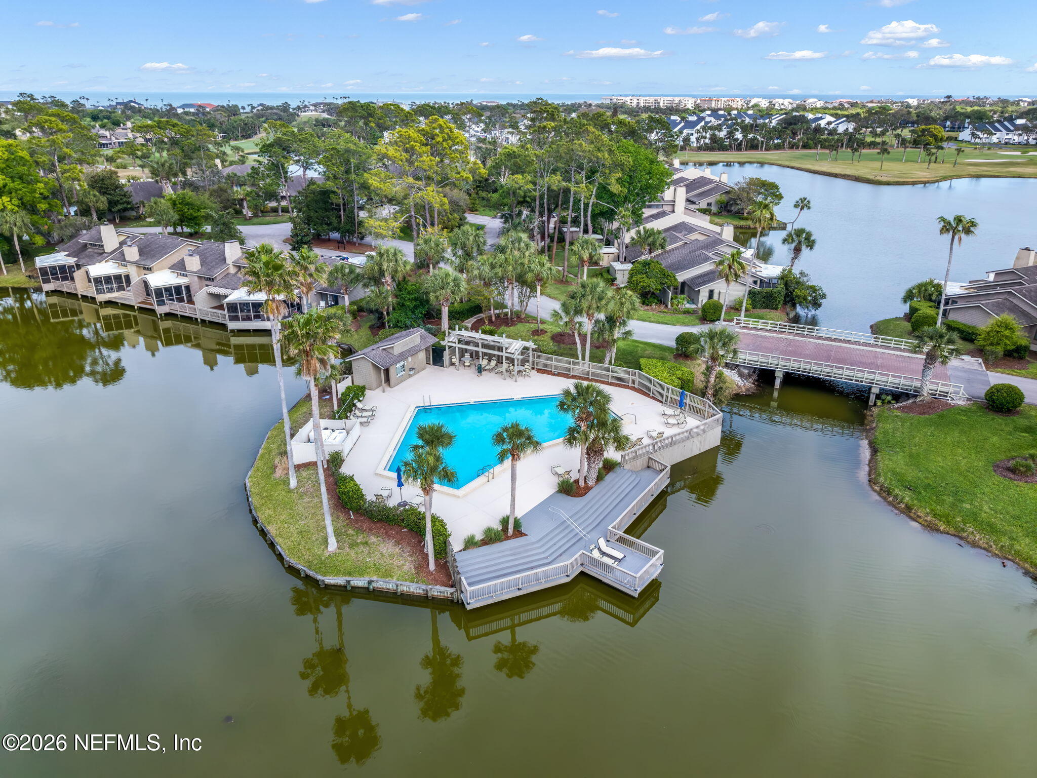 70 Fishermans Cove Road Ponte Vedra Beach, FL 32082 - Photo 43 of 60 a swimming pool with outdoor seating and lake view