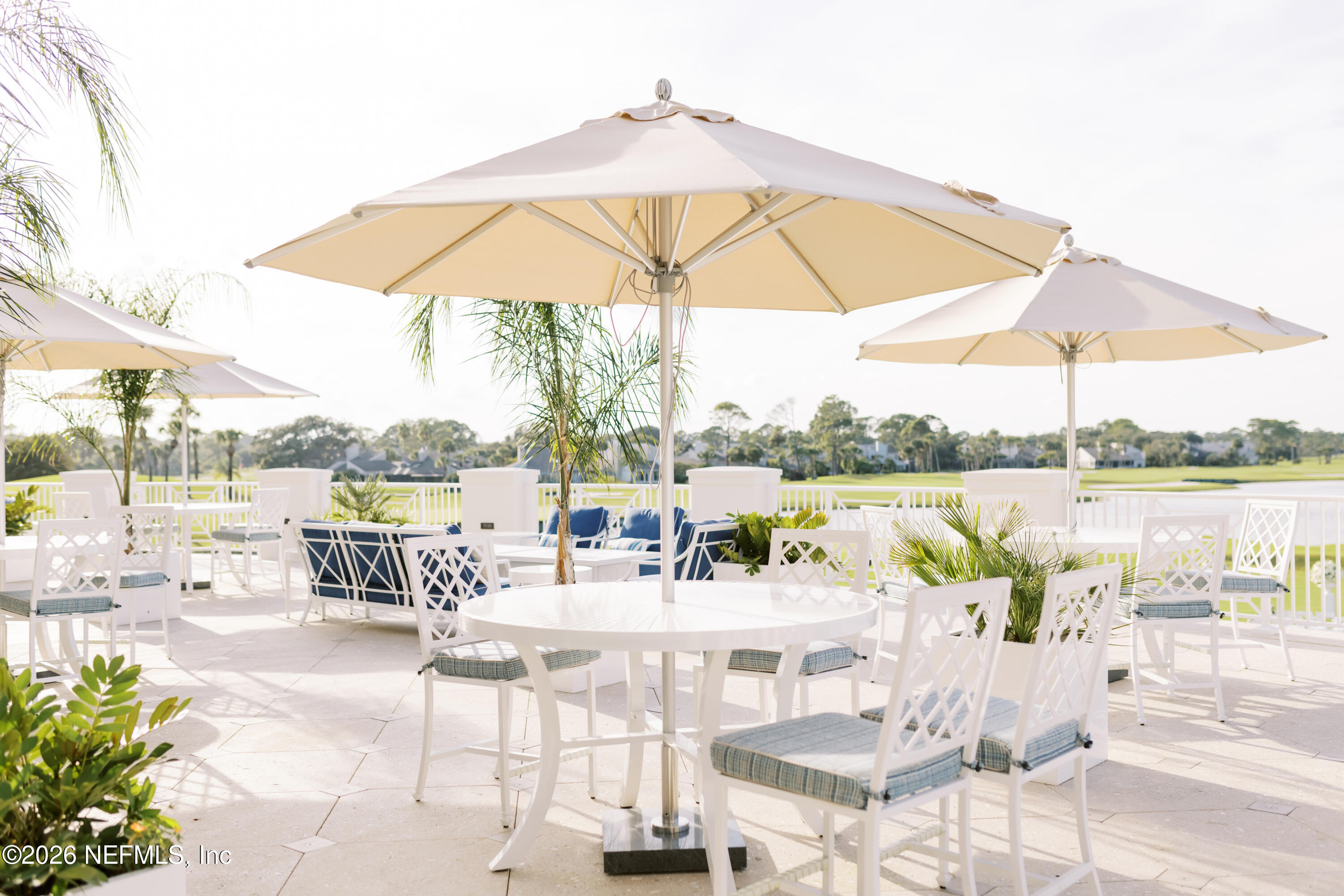 70 Fishermans Cove Road Ponte Vedra Beach, FL 32082 - Photo 55 of 60 a view of swimming pool with a table and chairs under an umbrella