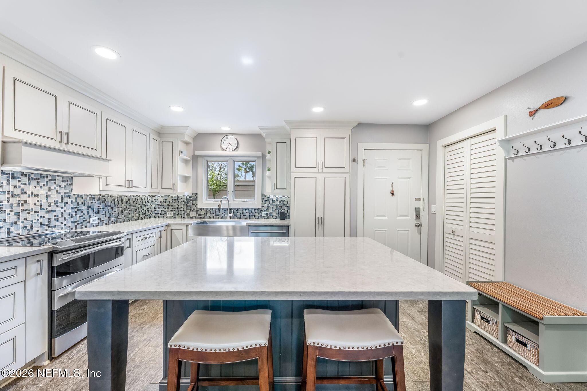 70 Fishermans Cove Road Ponte Vedra Beach, FL 32082 - Photo 8 of 60 a kitchen with stainless steel appliances a table chairs and a refrigerator
