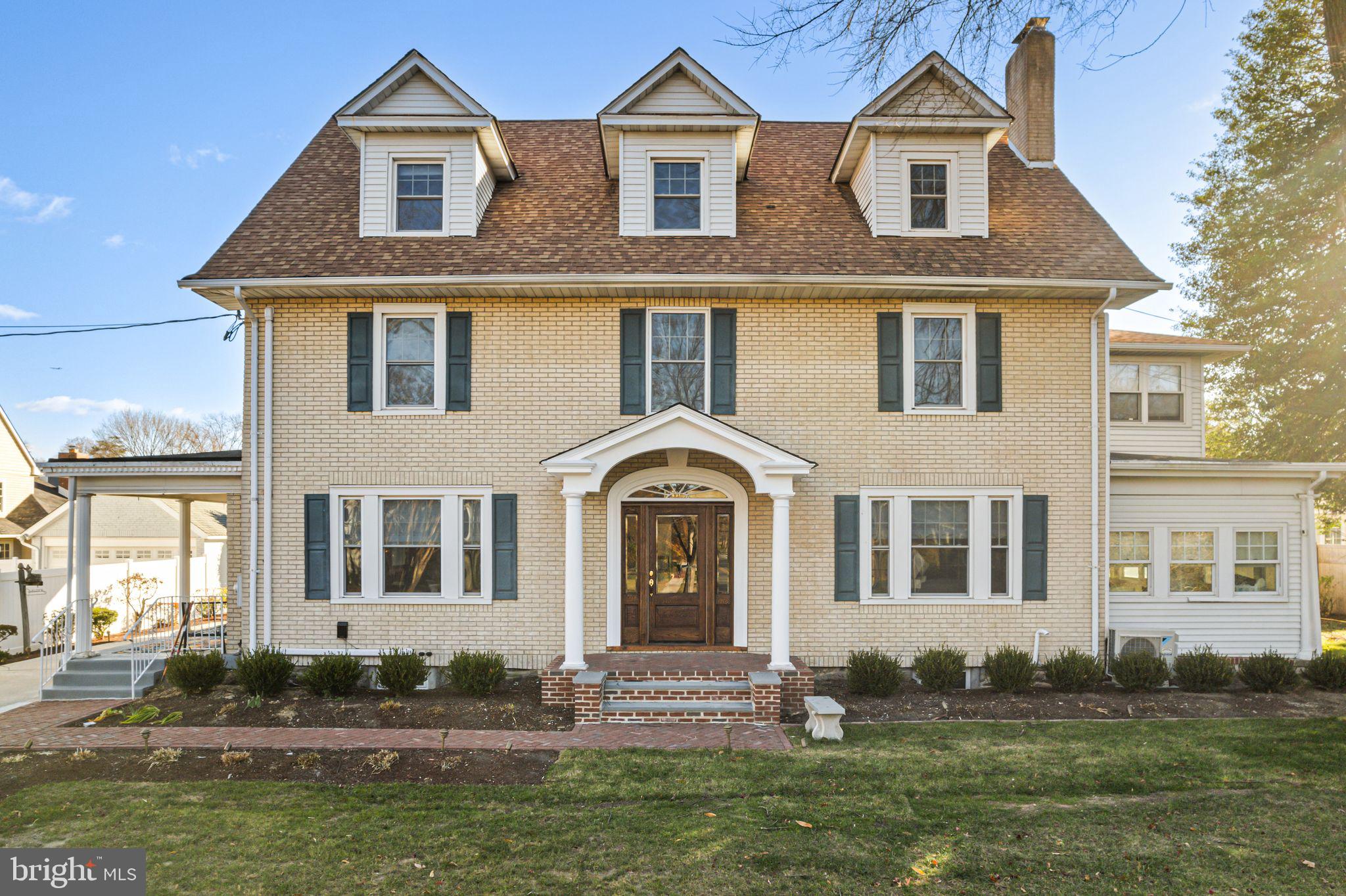 311 Chews Landing Road Haddonfield, NJ 08033 - Photo 1 of 31 a front view of a house with a yard