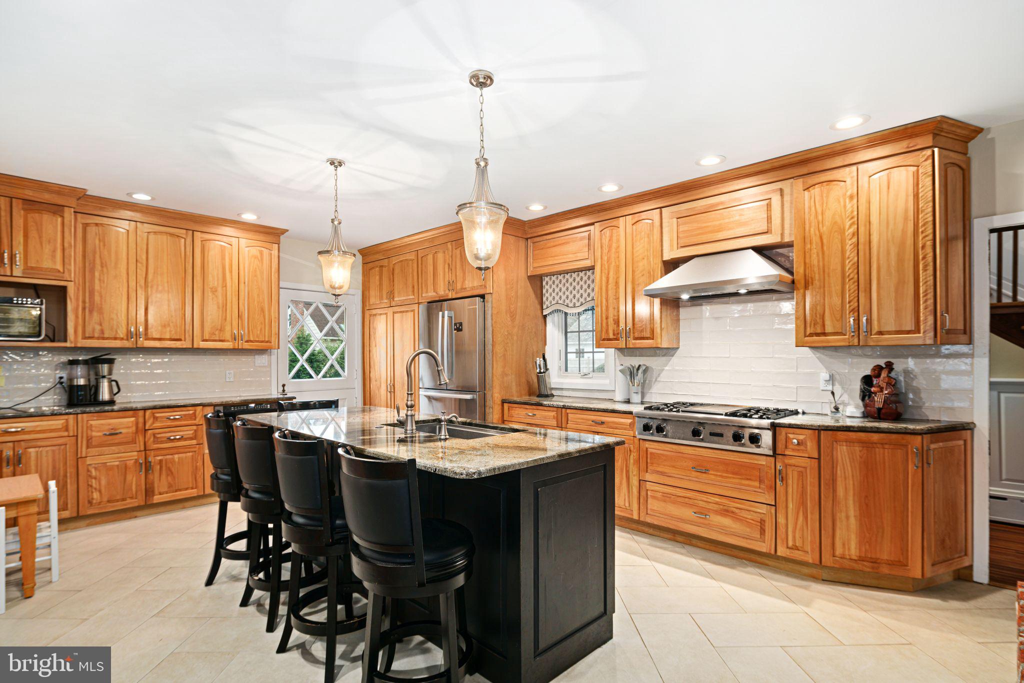 311 Chews Landing Road Haddonfield, NJ 08033 - Photo 13 of 31 a kitchen with a sink stove and cabinets
