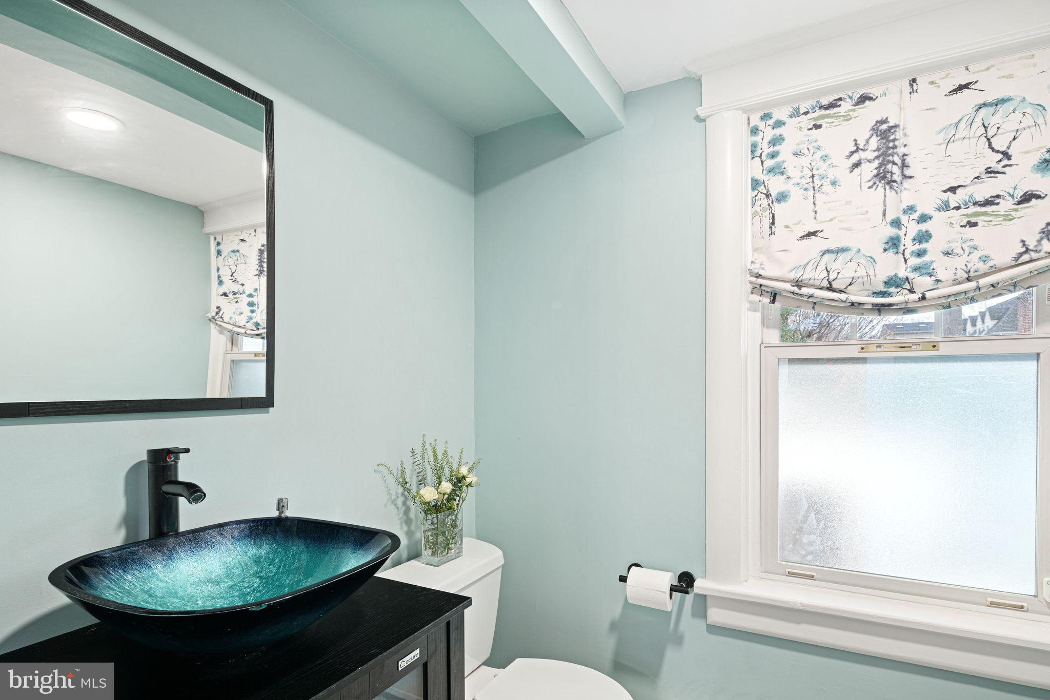 311 Chews Landing Road Haddonfield, NJ 08033 - Photo 18 of 31 a bathroom with a sink toilet and a mirror